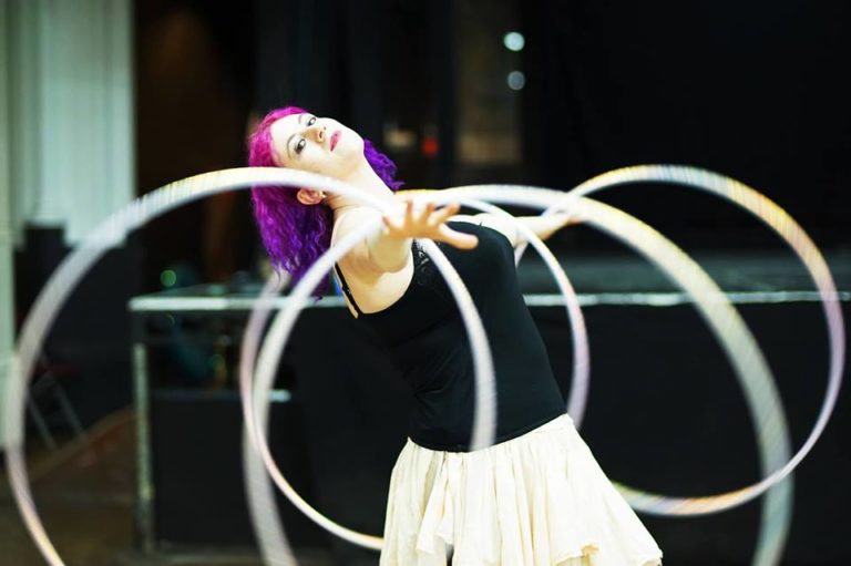 Hula Hooper spinning four hoops
